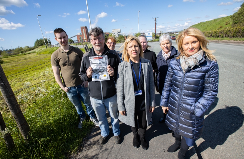 Esther McVey, Cllr Helen Treeby and local residents outside the site of an incinerator currently being built in Rudheath